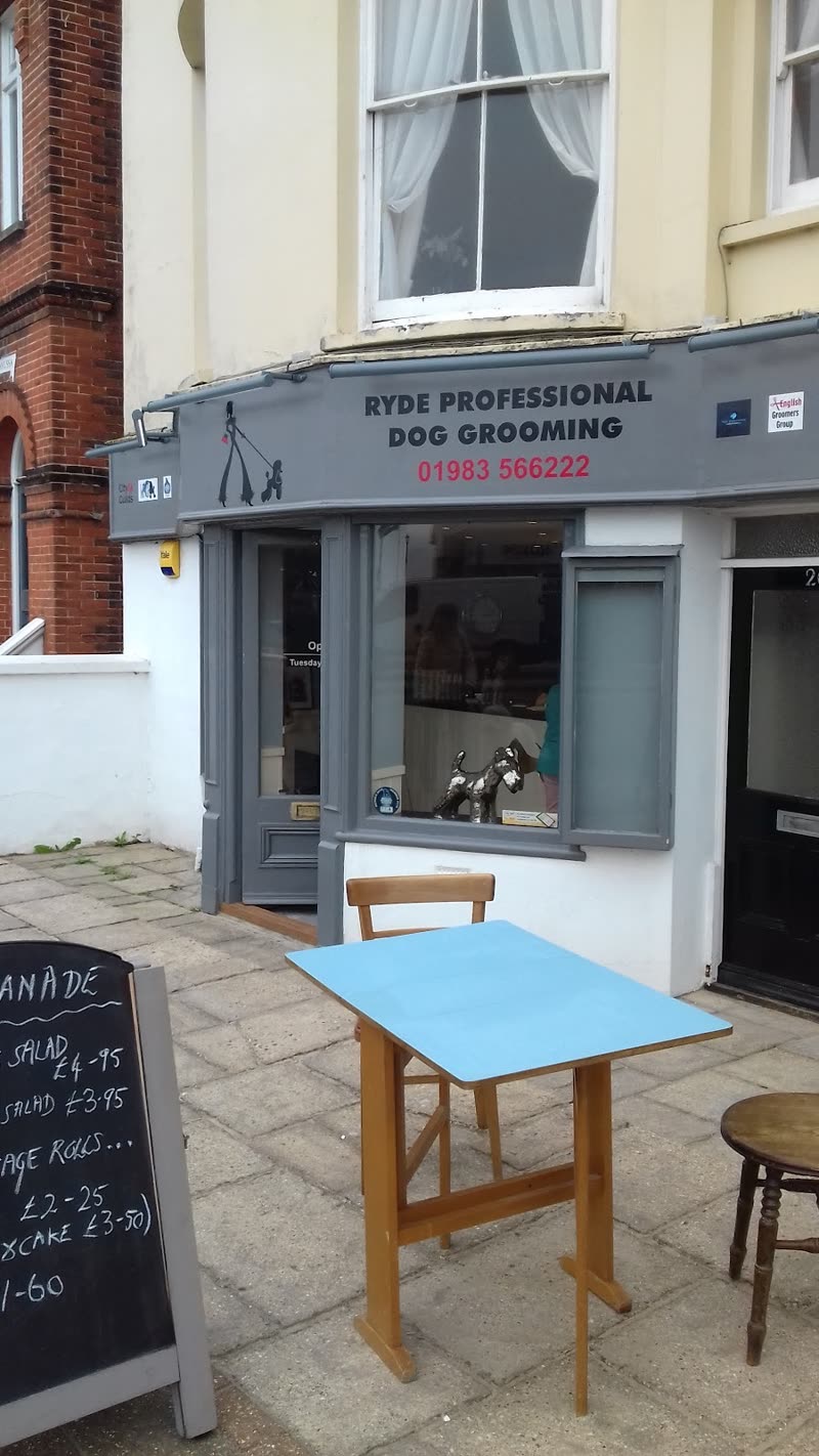 The shopfront of Ryde Professional Dog Grooming on the Esplanade, grey frontage with a chalkboard outside